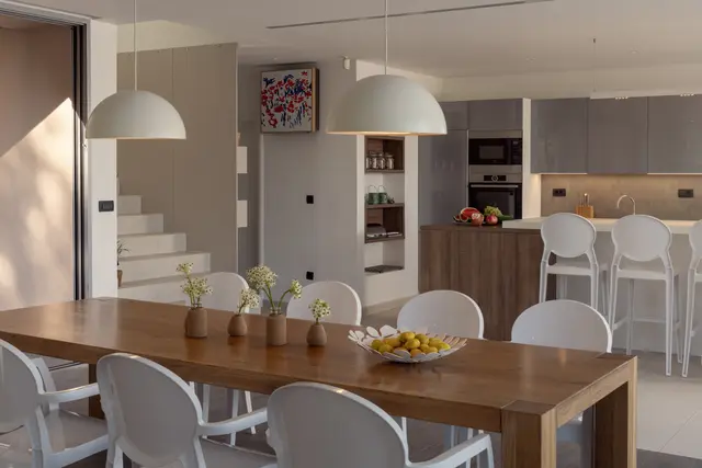 Dining table with the kitchen beyond