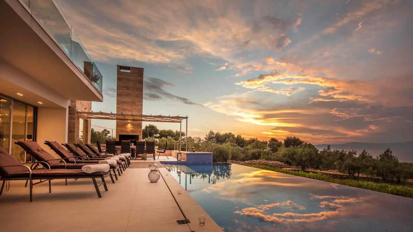 Three distinctive villas. One family behind them.