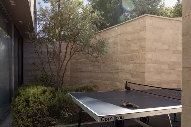 Table tennis in the stone courtyard
