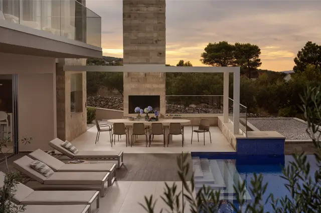 Terrace and outdoor fireplace at sunset