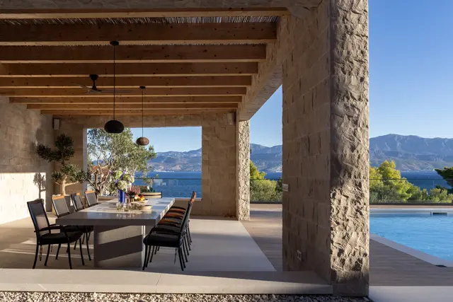 The dining pavilion opening straight onto the pool