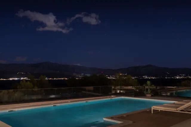 The pool at night, mainland lights across the water