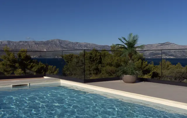 Infinity edge over the pines and the open sea